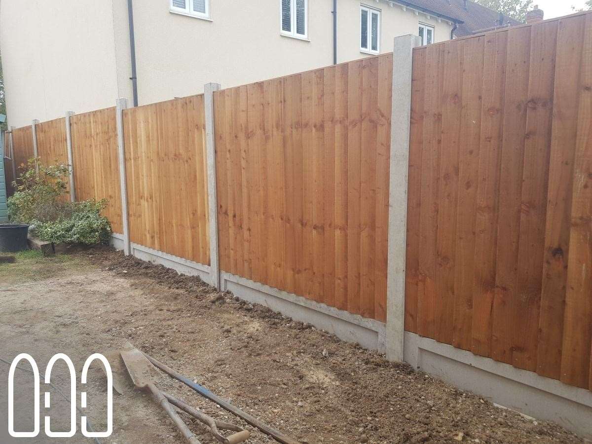 Close board fencing with wooden posts and gravel boards plus a new gate