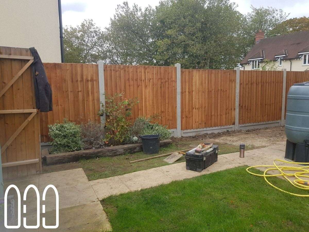 Close board fencing with wooden posts and gravel boards plus a new gate