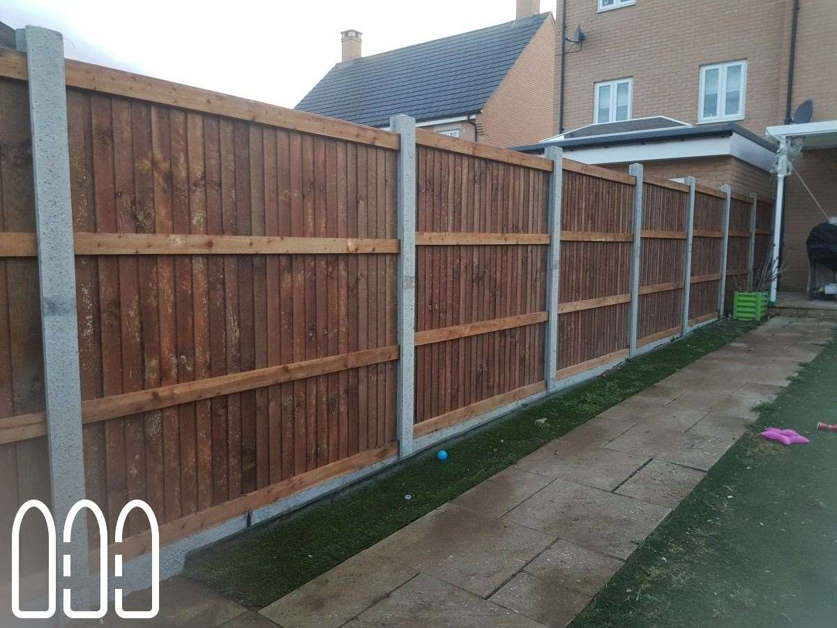 Close board fencing with concrete posts and gravel boards