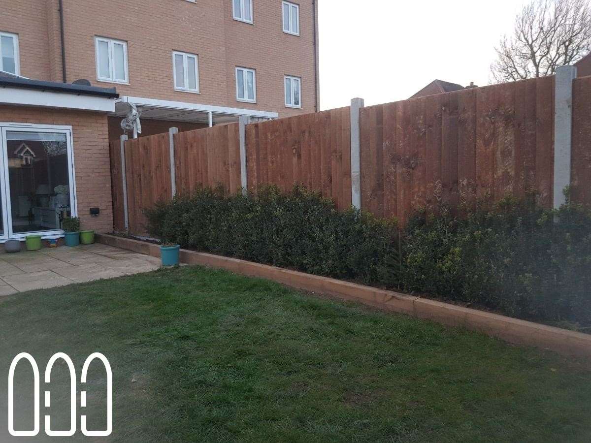 Close board fencing with concrete posts and gravel boards