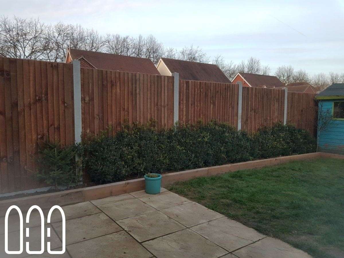 Close board fencing with concrete posts and gravel boards