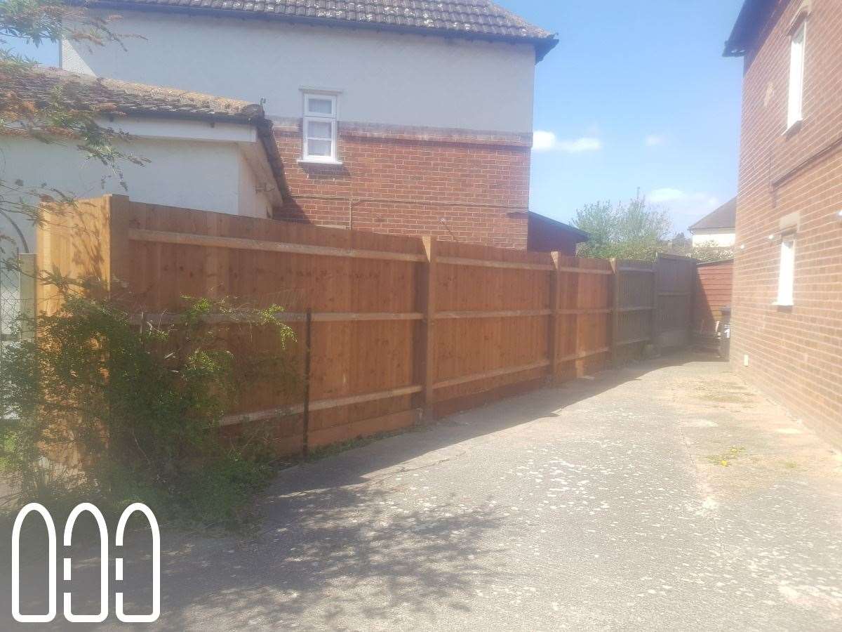 Feather edge fencing with wooden posts and gravel boards