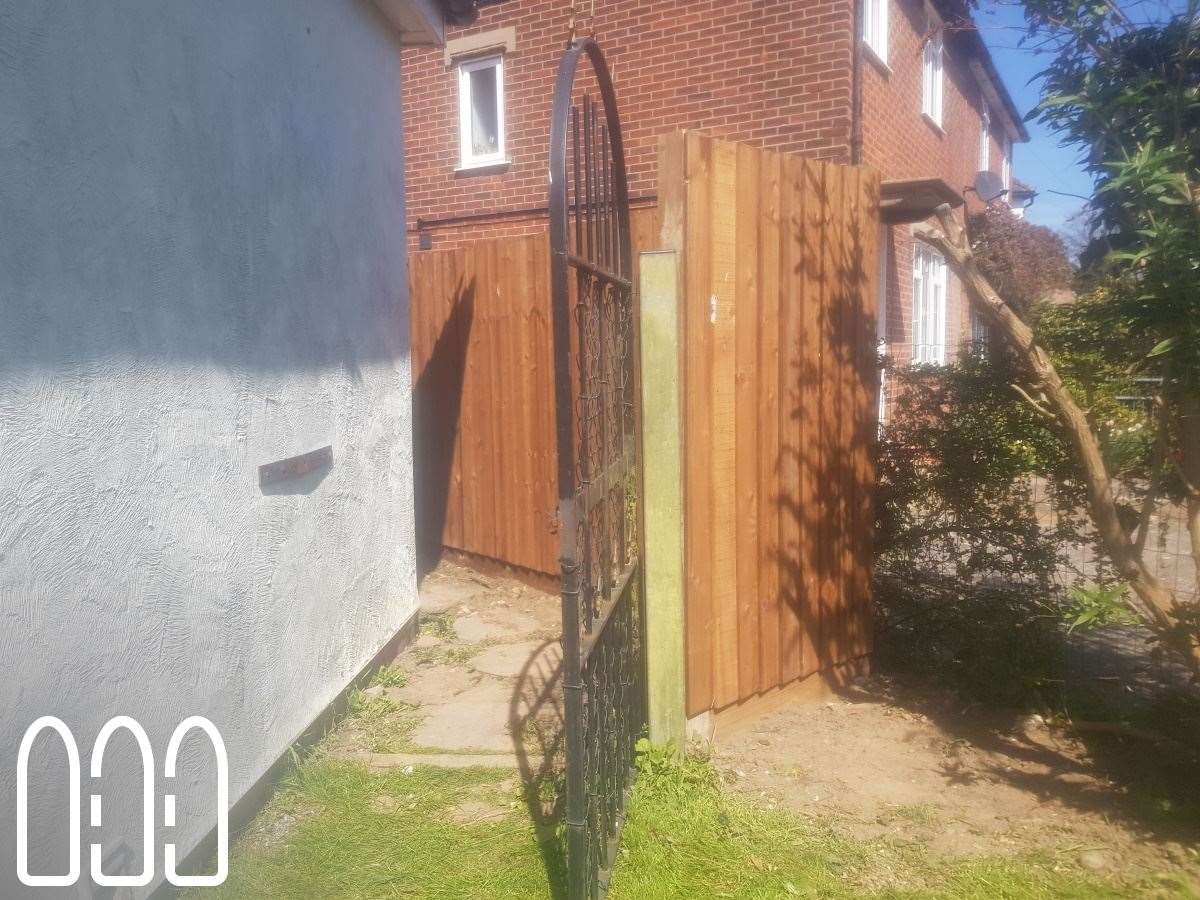 Feather edge fencing with wooden posts and gravel boards