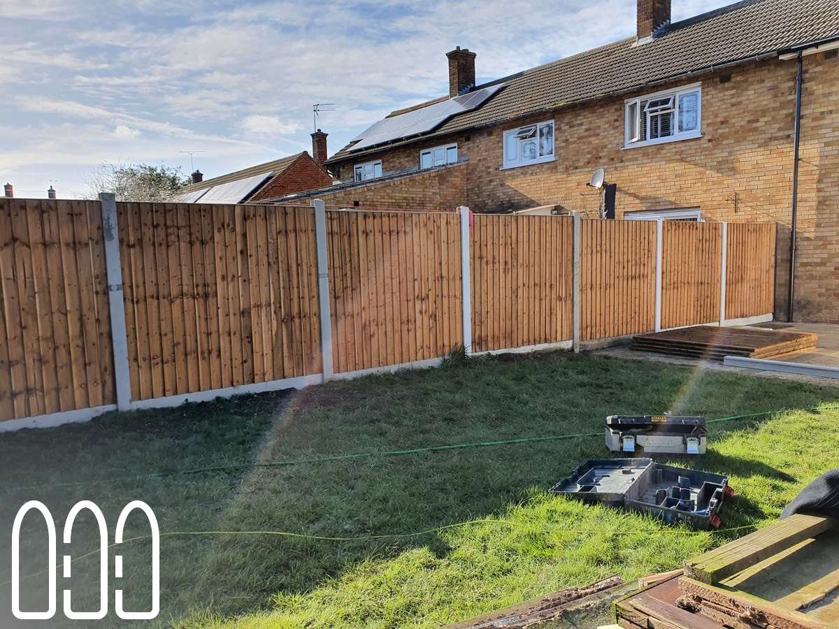 Close board fencing with concrete posts and gravel boards