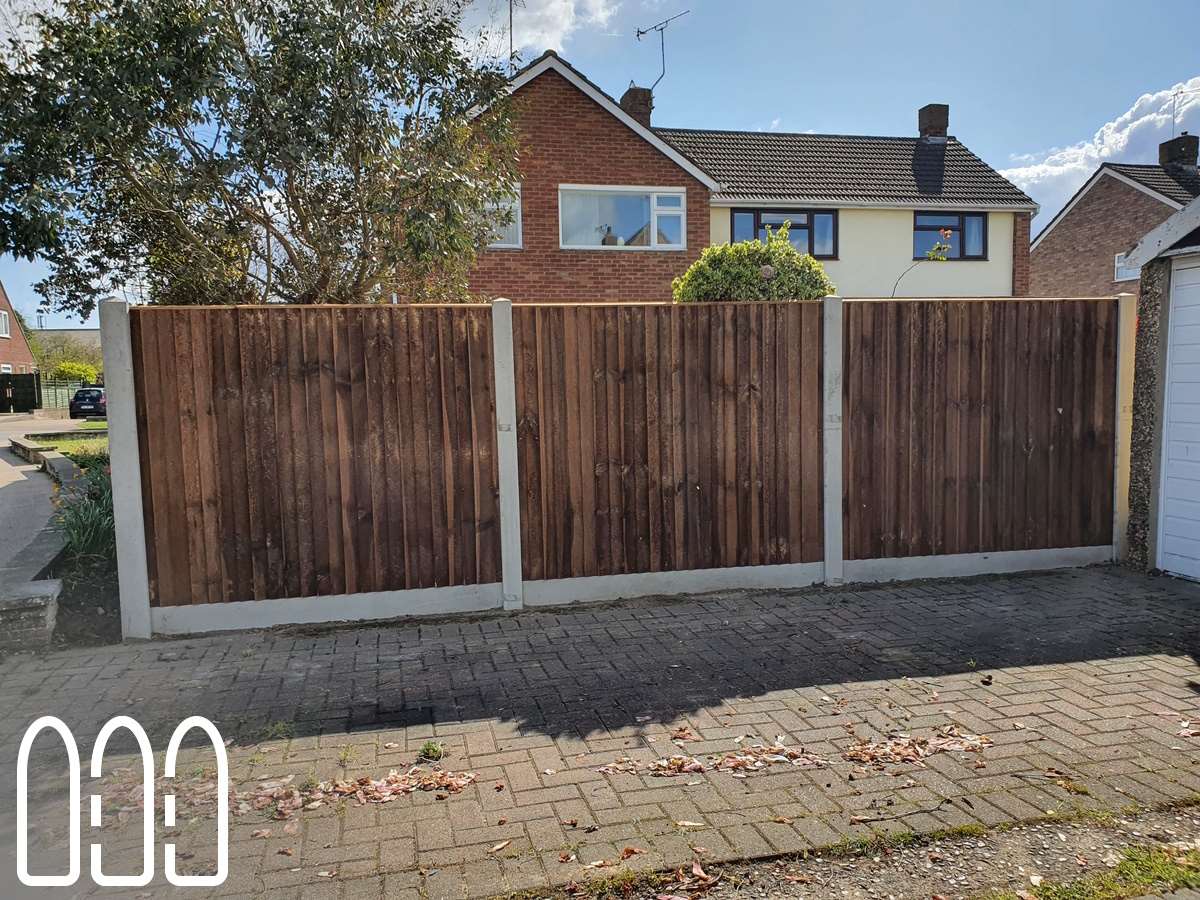 Close board fencing with concrete posts and gravel boards