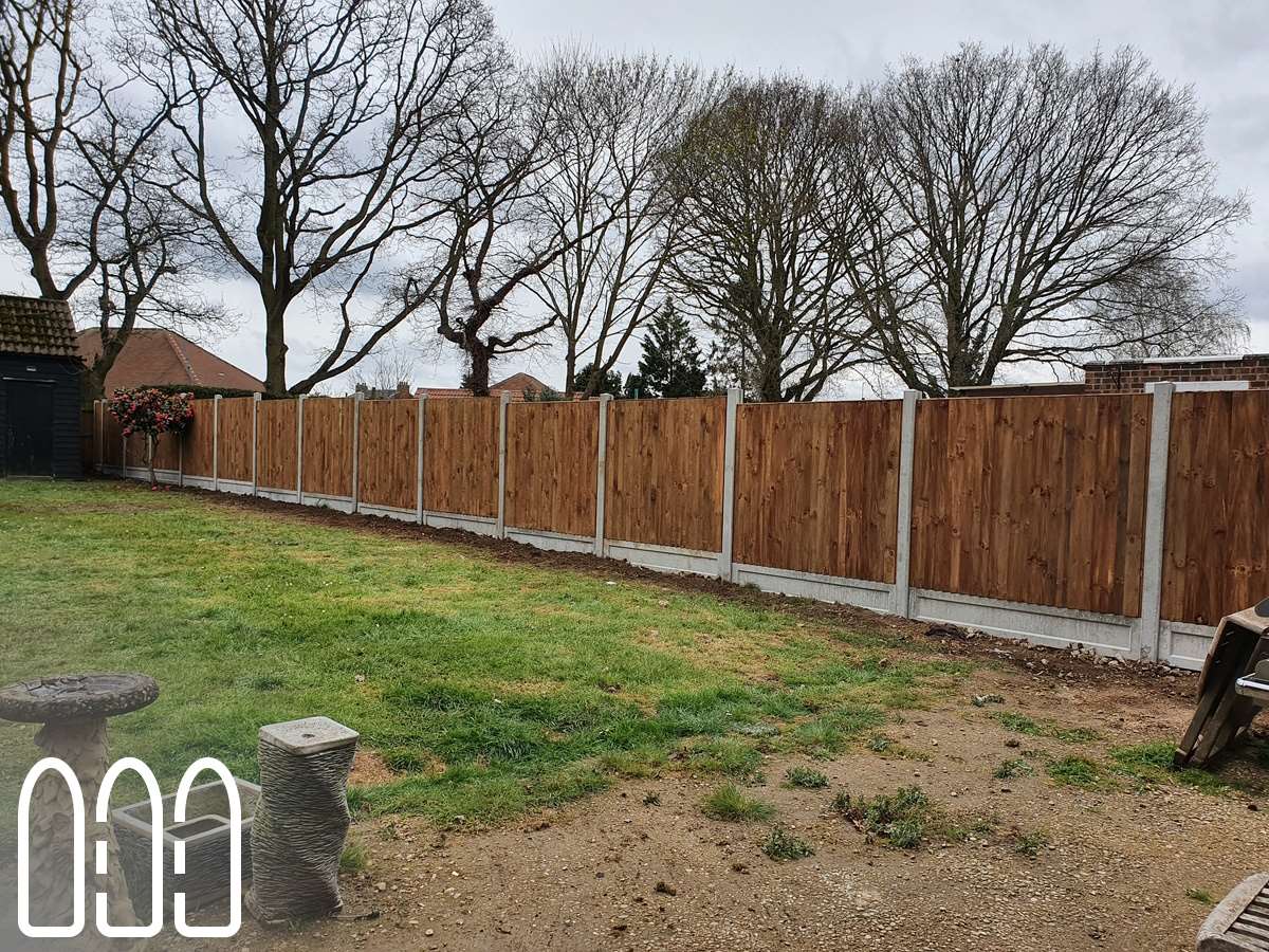 Close board fencing with concrete posts and gravel boards