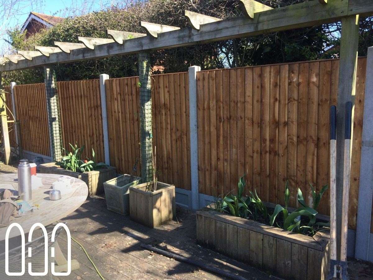 Close board fencing with concrete posts and gravel boards