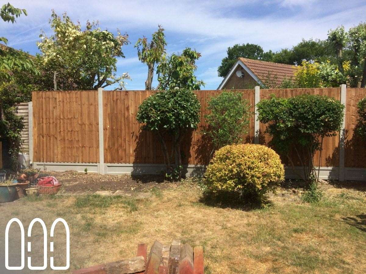 Close board fencing with concrete posts and gravel boards