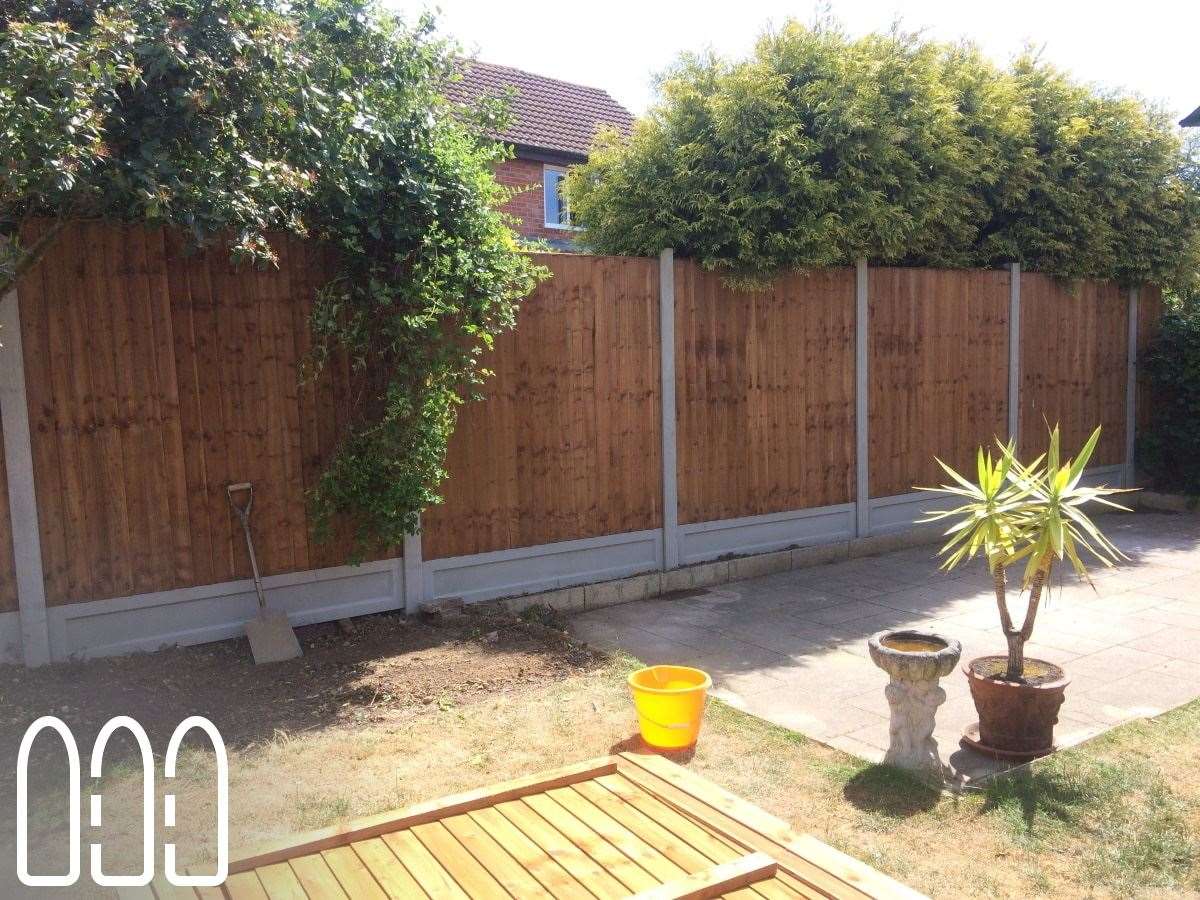 Close board fencing with concrete posts and gravel boards