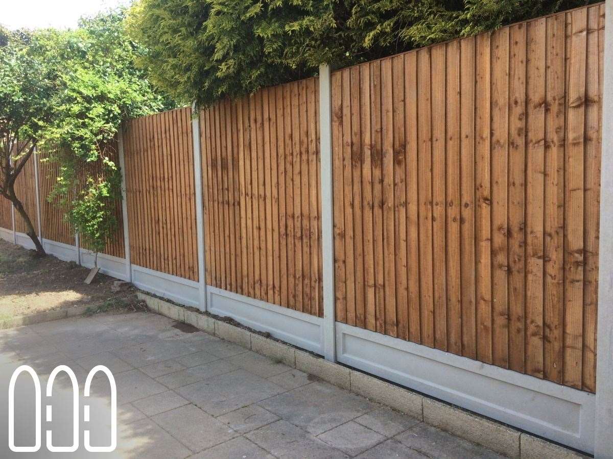 Close board fencing with concrete posts and gravel boards