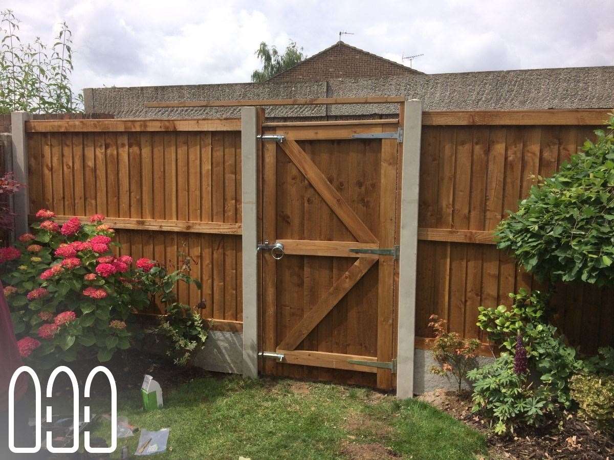 Close board fencing with concrete posts, gravel boards and a FLB gate