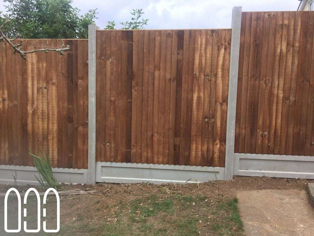 Close board fencing with concrete posts and gravel boards