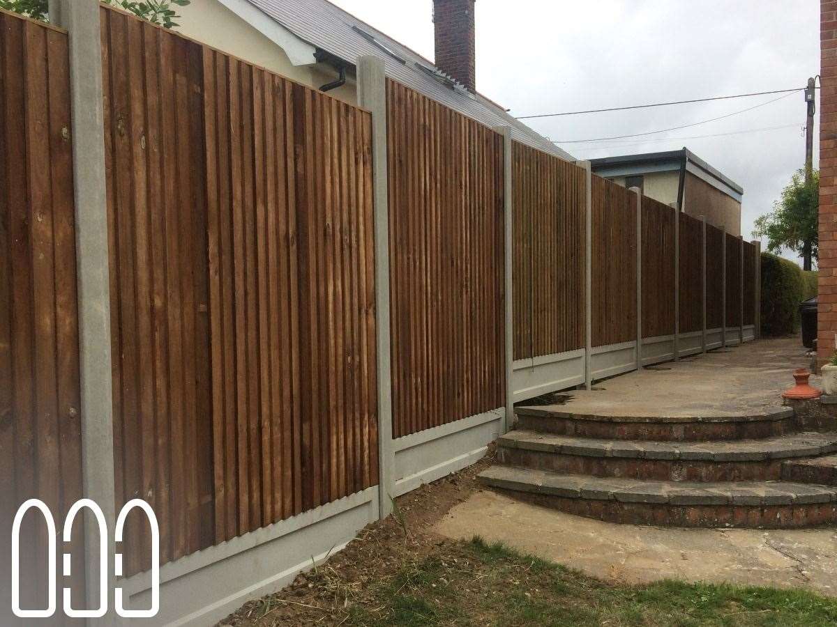 Close board fencing with concrete posts and gravel boards