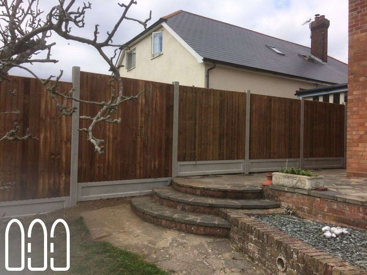 Close board fencing with concrete posts and gravel boards