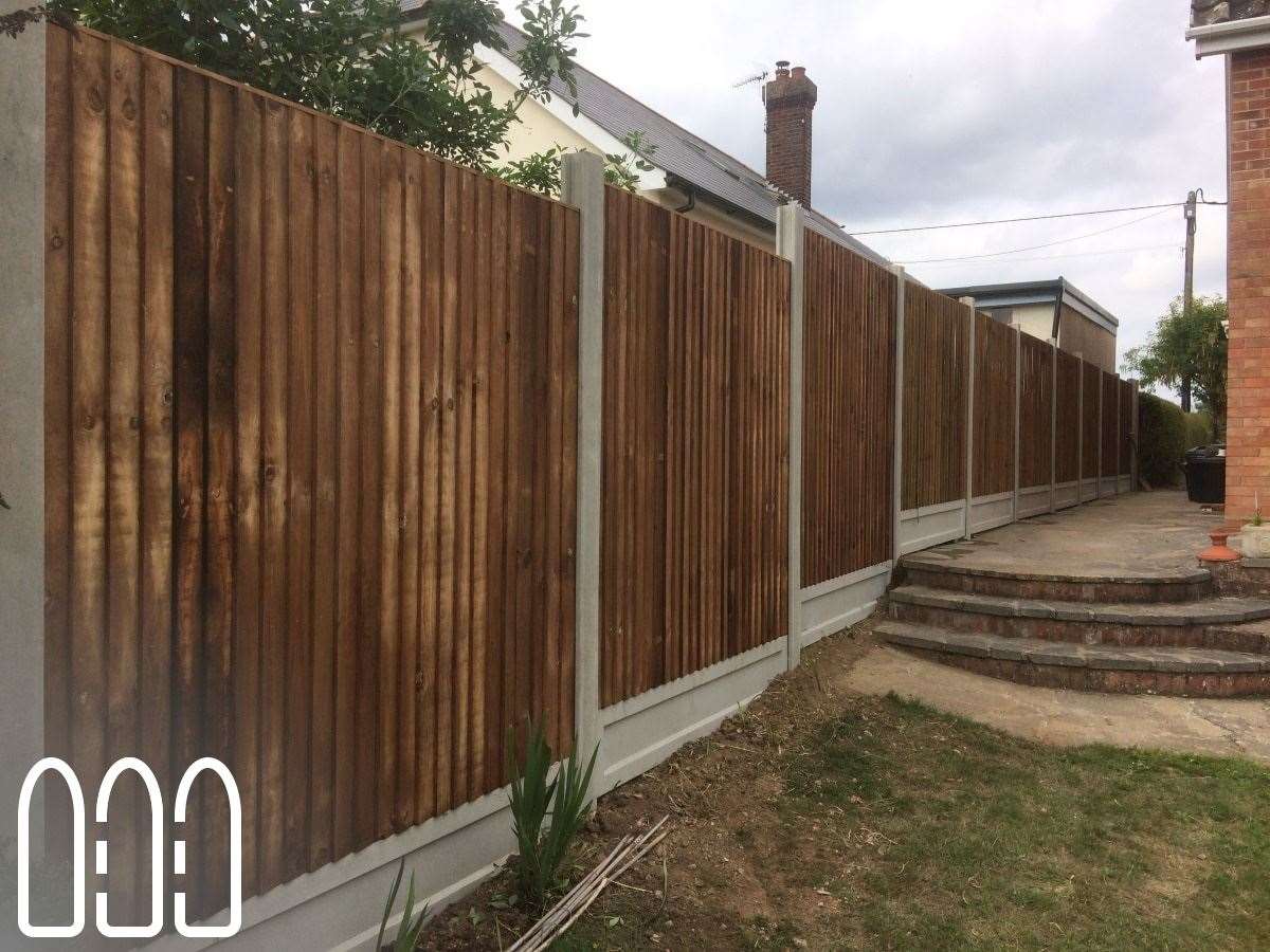 Close board fencing with concrete posts and gravel boards